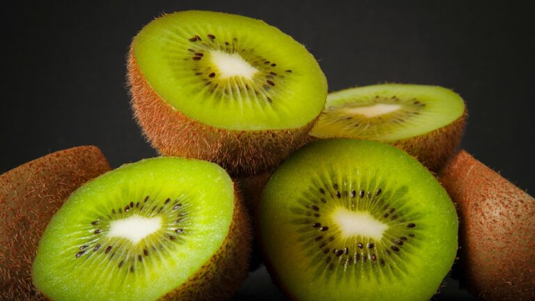 Fresh kiwi fruit showing green flesh and seeds, highlighting nutrition and health benefits